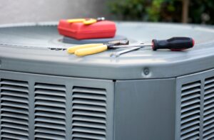 AC Repair in El Reno, OK 1 An HVAC technician is diligently servicing an HVAC unit, ensuring optimal performance and efficiency.